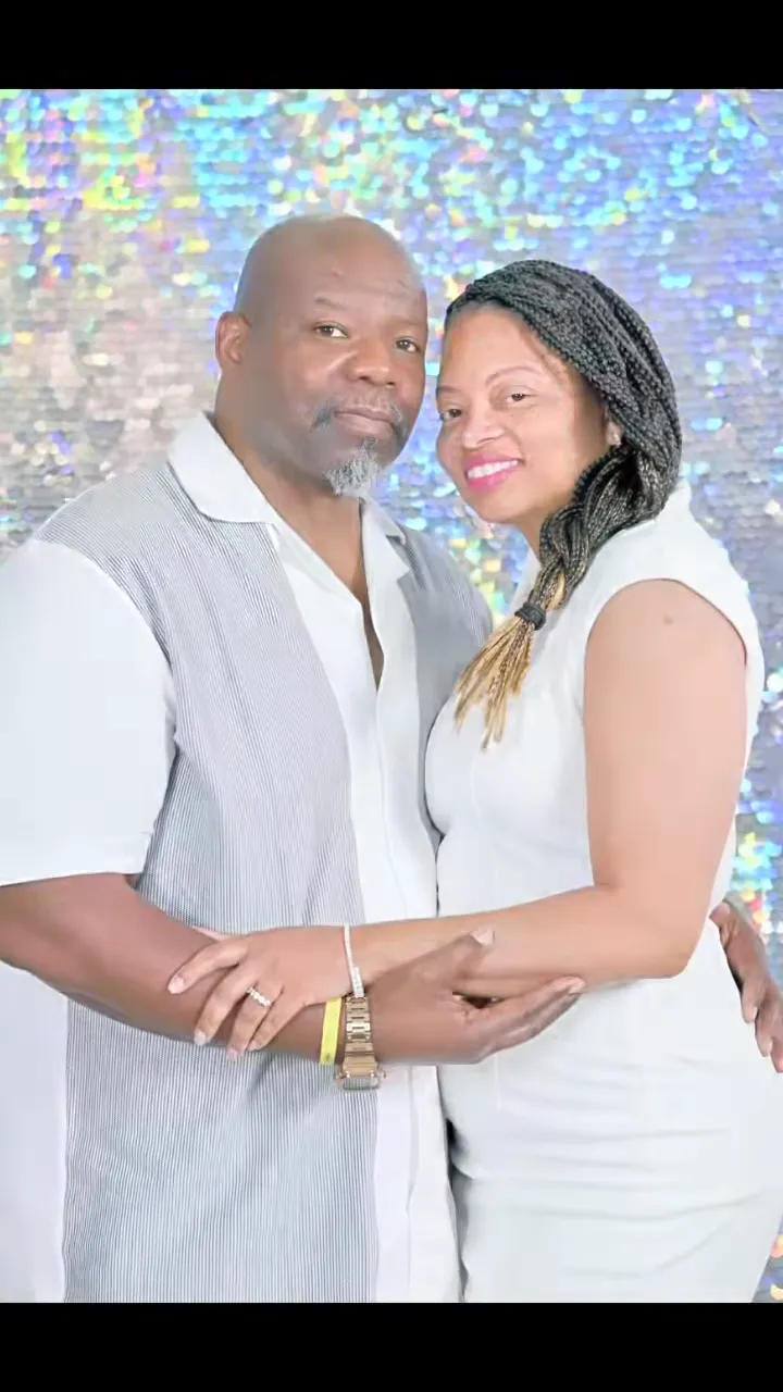 Tenisha and Chris dressed in white
